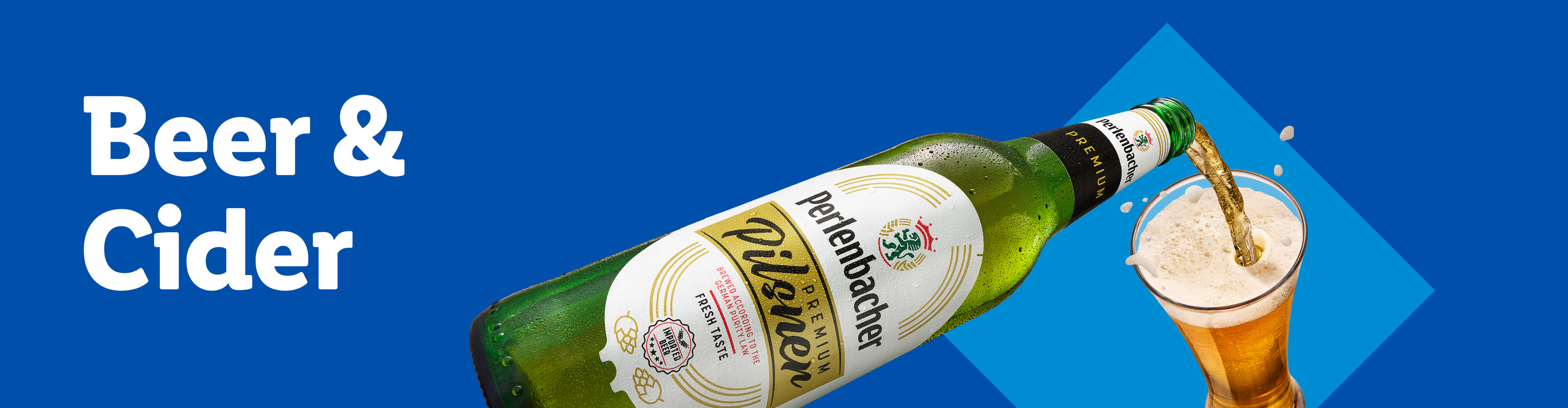 A bottle of Perlenbacher Premium Pilsner beer pouring into a glass against a blue background.