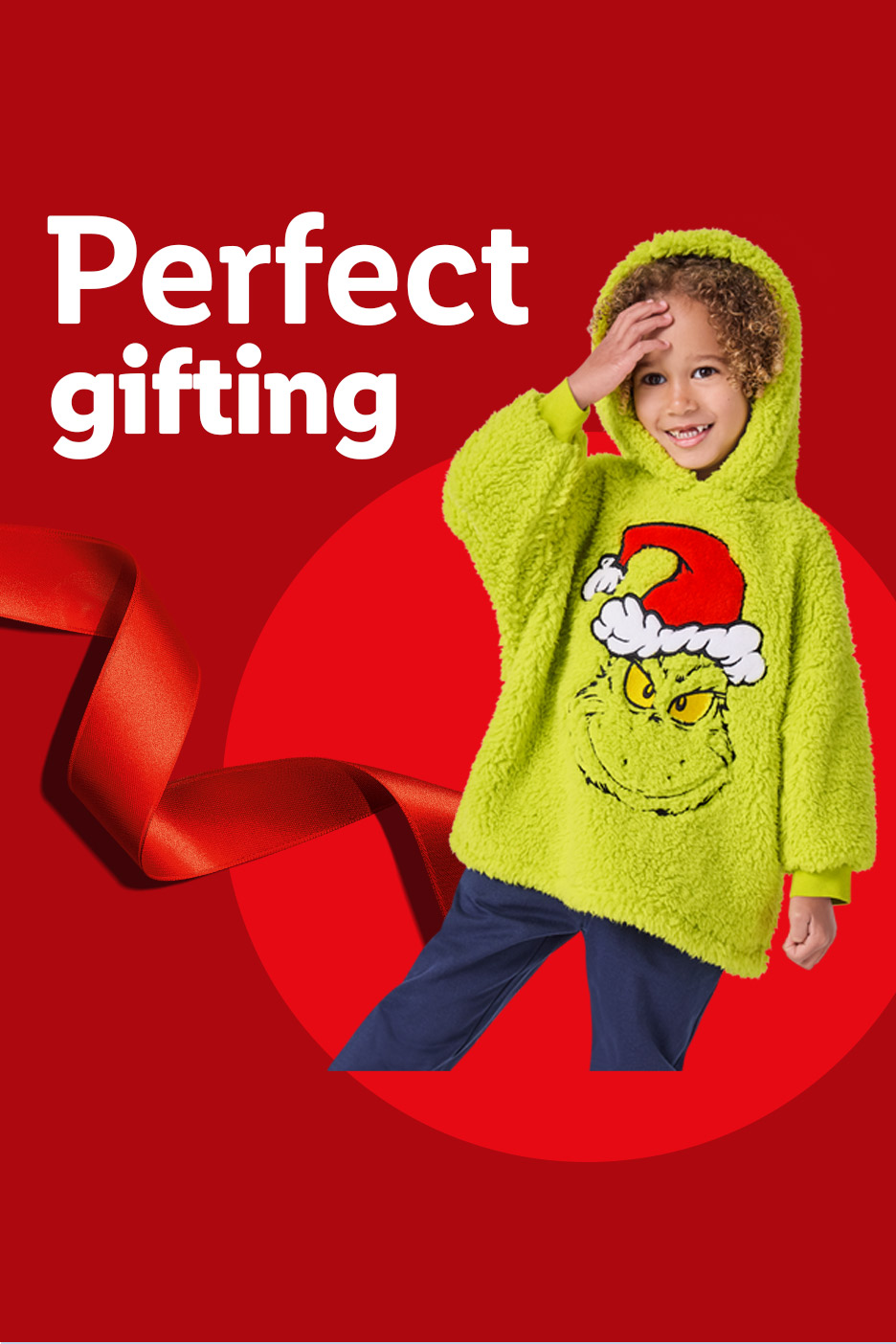 Child in a green Grinch hooded blanket, with text 'Perfect gifting' and a red ribbon.