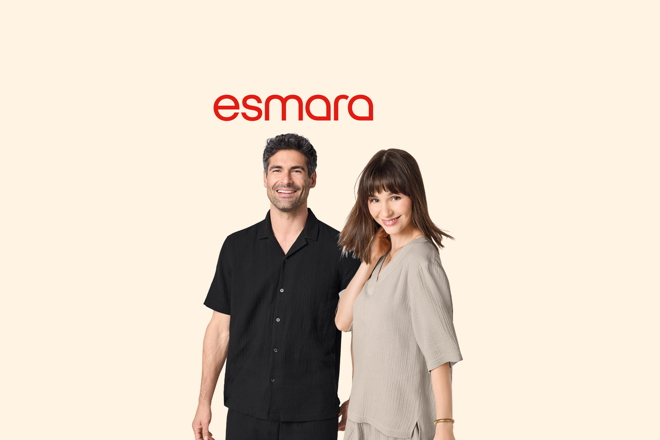 Man and woman in matching black and beige textured short-sleeved shirts and shorts.