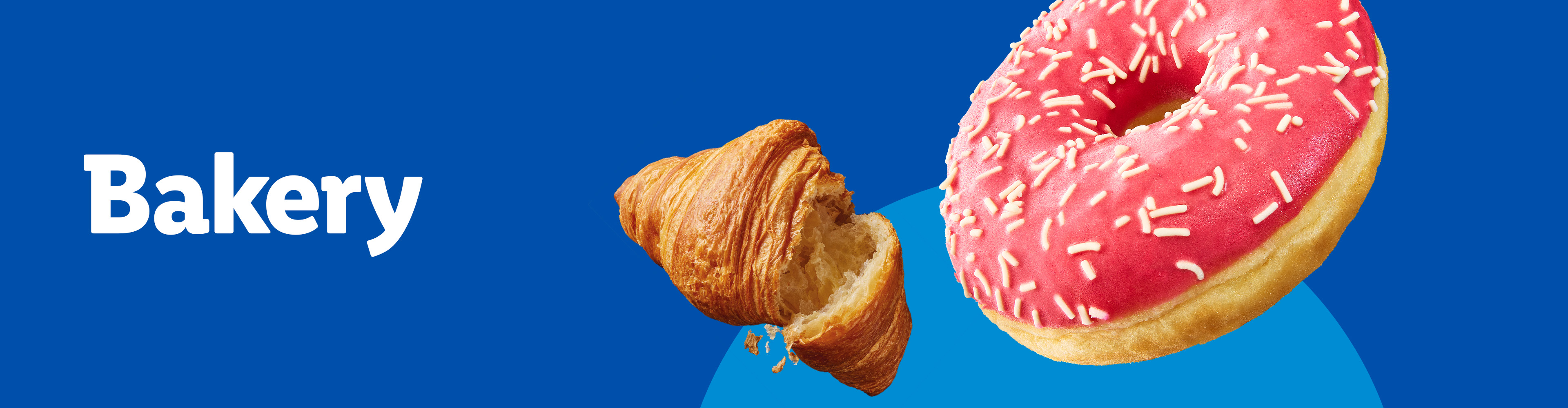 A croissant and a pink frosted donut with sprinkles on a blue background.