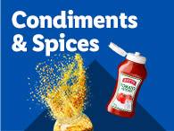 A bottle of Heinz tomato ketchup and a burst of spices, illustrating condiments and spices.