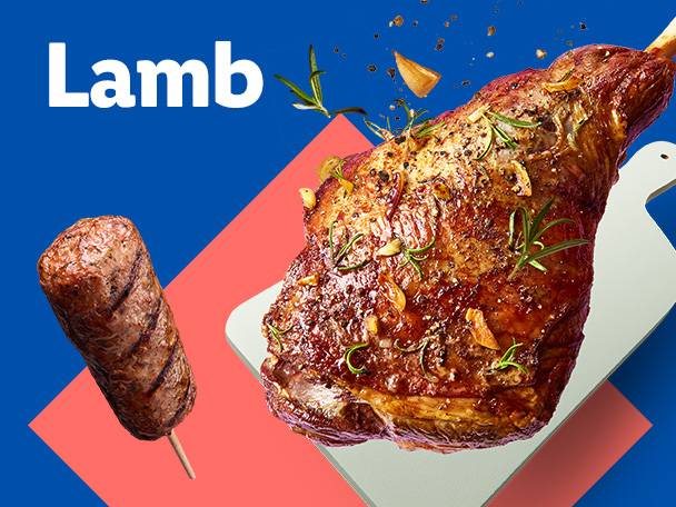 A roasted leg of lamb and a lamb sausage on a skewer.