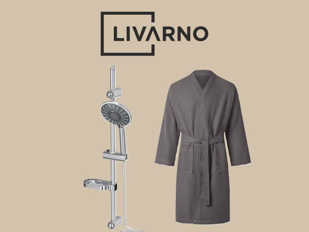 A grey bathrobe and a chrome shower set on a light brown background.