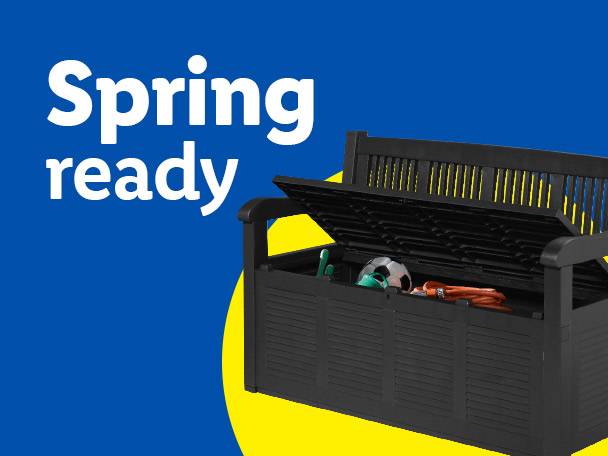 Black outdoor storage bench with gardening tools and a football inside, text 'Spring ready'.