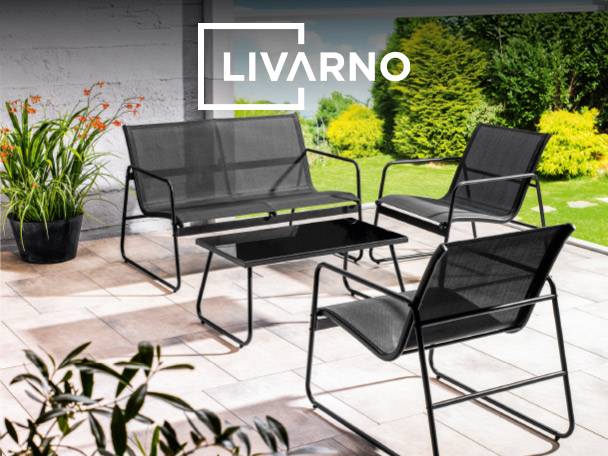 Outdoor patio furniture set with a sofa, chairs, and coffee table, on a patio.
