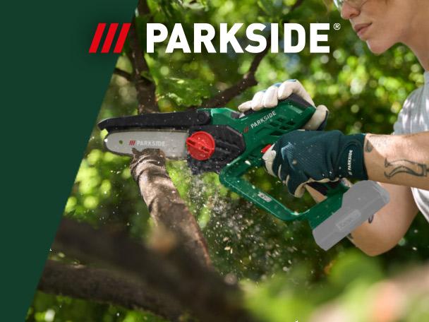A person using a cordless mini chainsaw to cut a tree branch.