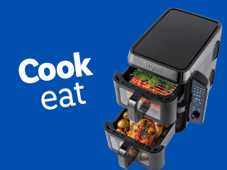 Dual Cuisinart air fryer with food.